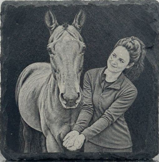 Slate engraving example of a horse beside a person