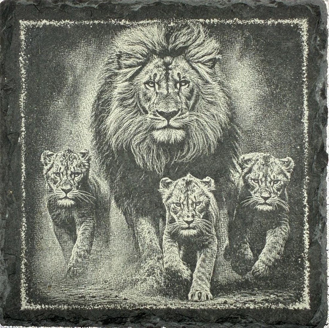 Four lions engraved on slate