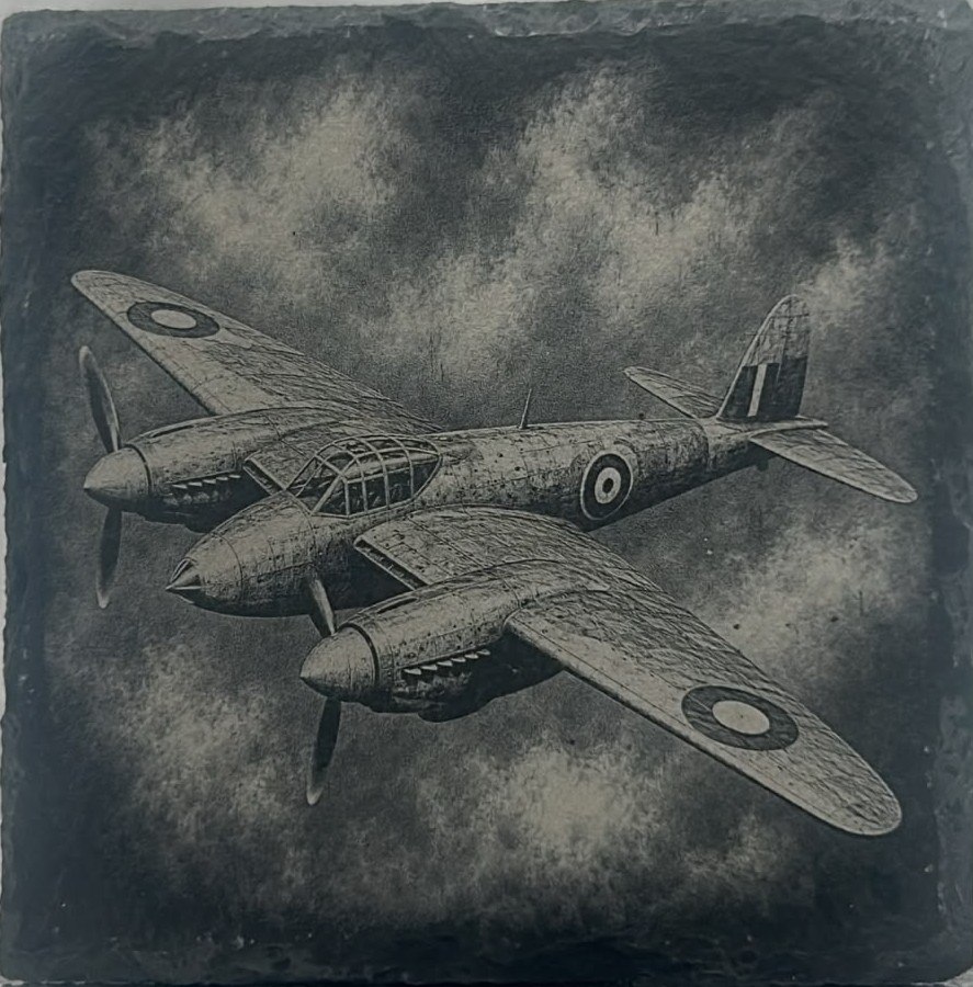 Second vintage aircraft in flight engraved on slate