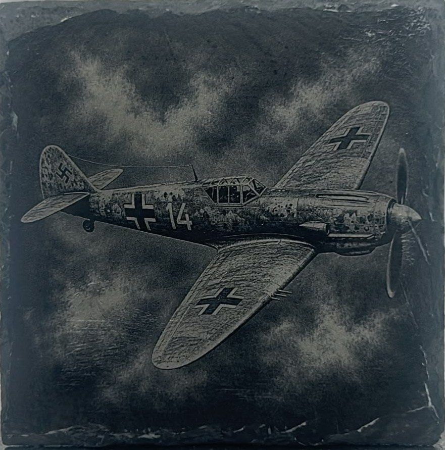 Aircraft with cross markings engraved on slate